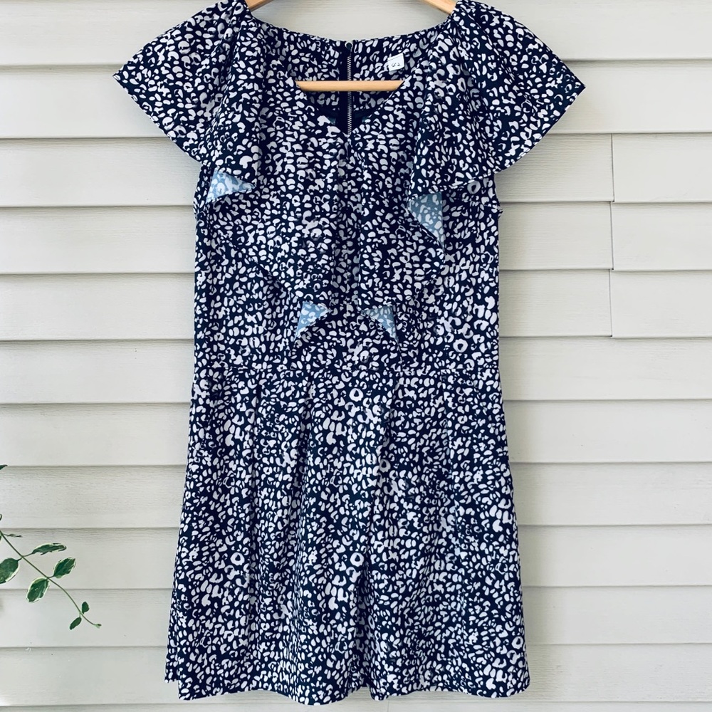 Blue and white romper with ruffle detail